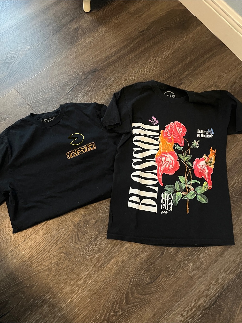 2 black graphic tees. Size small